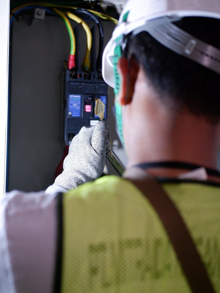 Man working on an electrical device.