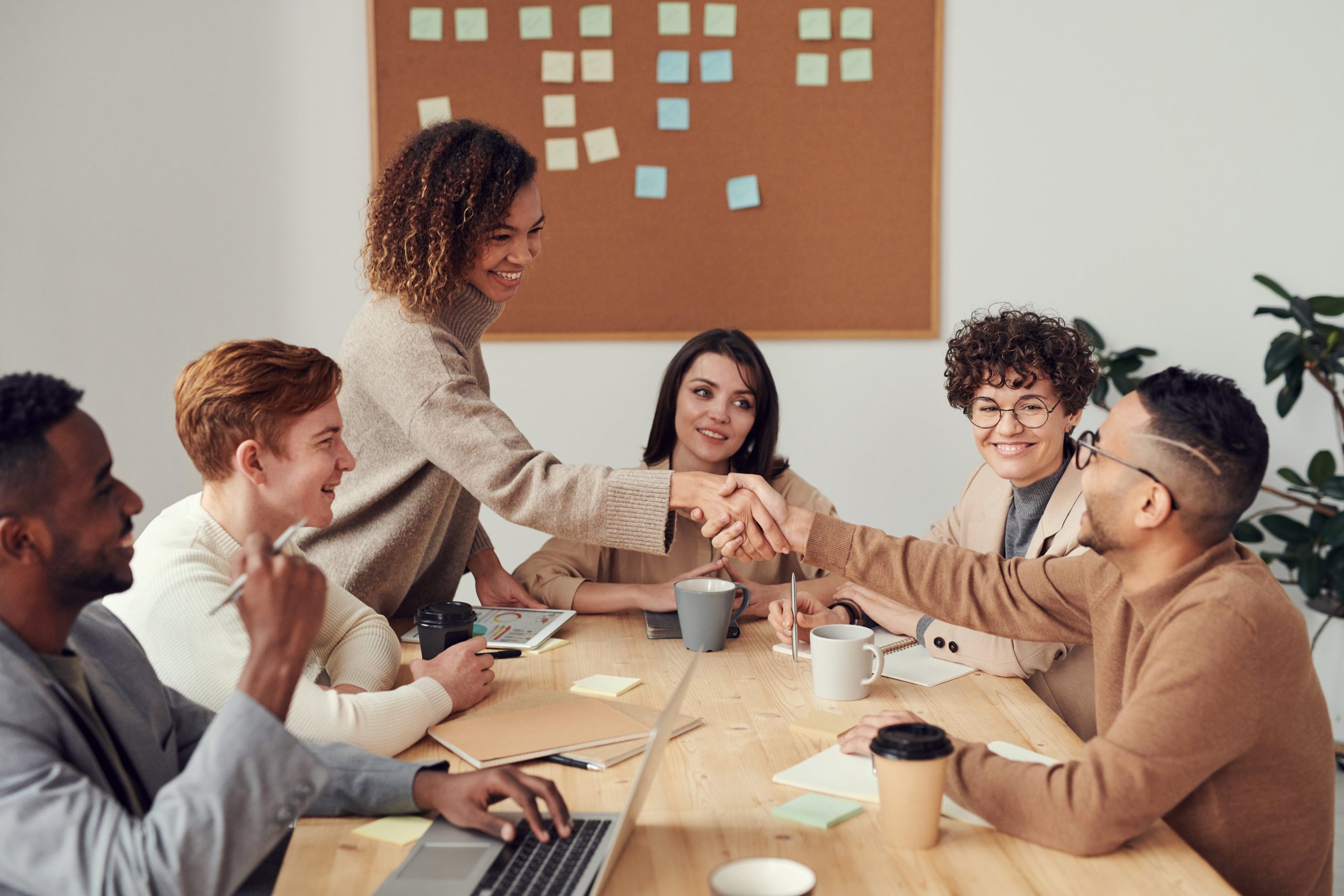 Group of people attending a meeting.
